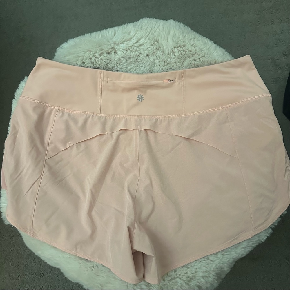 Athleta lined running shorts in peach